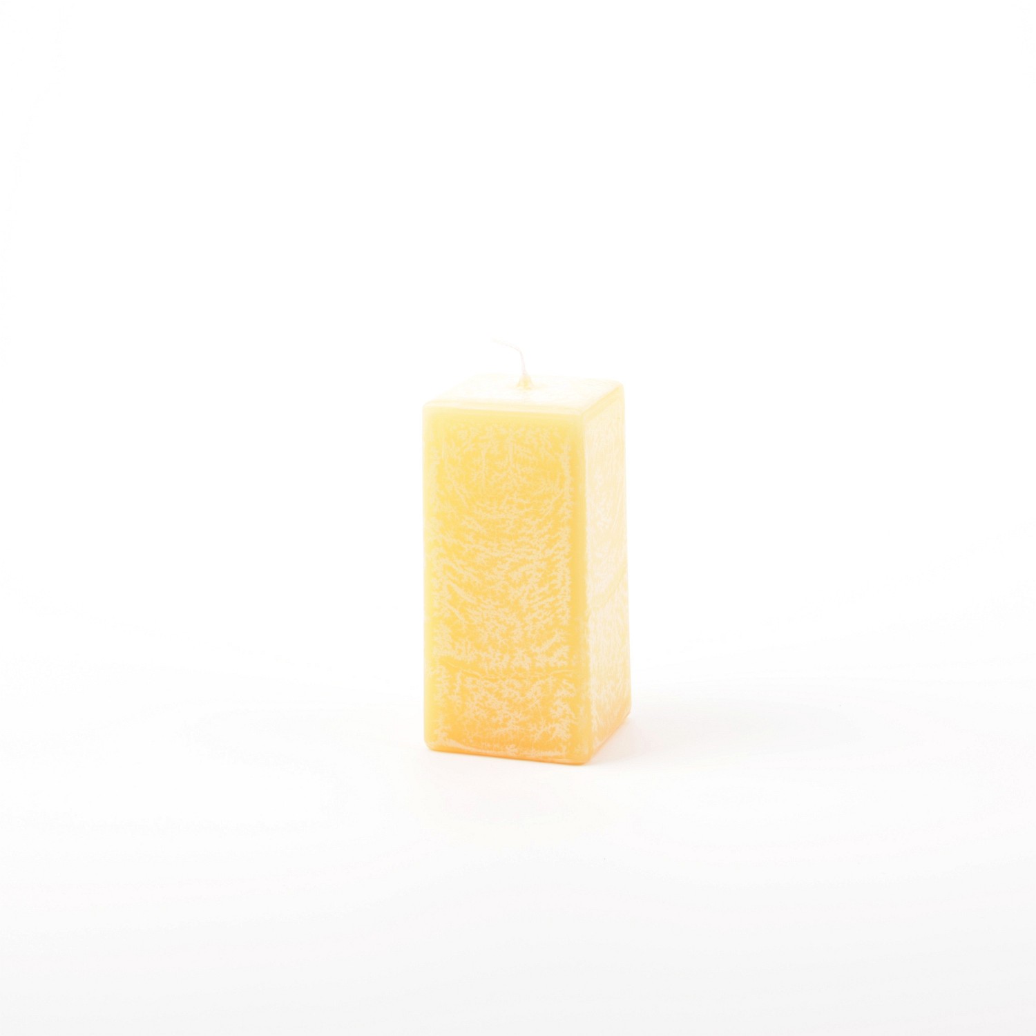 Eckige zitronenfarbene Stumpenkerze mit Marmorierung
